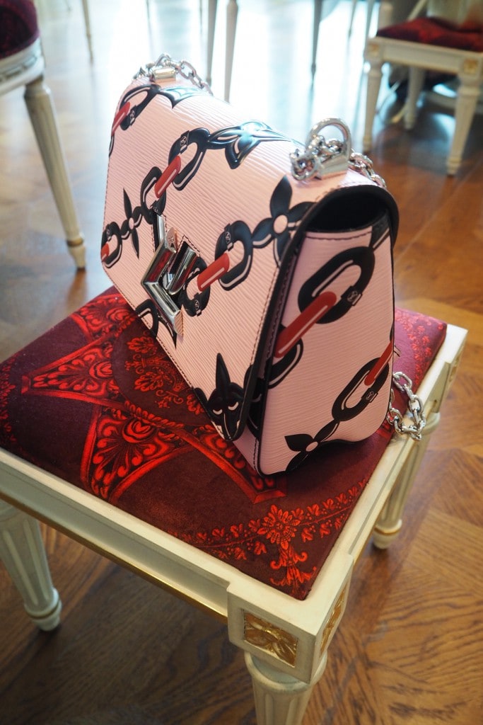 Louis Vuitton bag restaurant seat