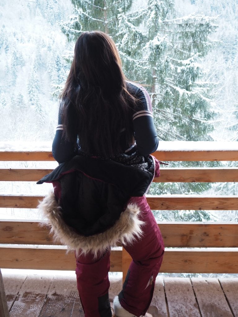 Bonnie Rakhit the style traveller ski hot tub in Morzine The white valley company what to wear on a ski trip - huski onesie ski suit