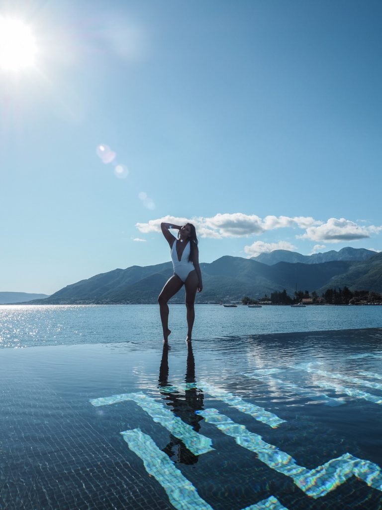 Bonnie Rakhit Style Traveller at Regent porto Montenegro luxury hotel beautiful infinity pool white asos swimsuit