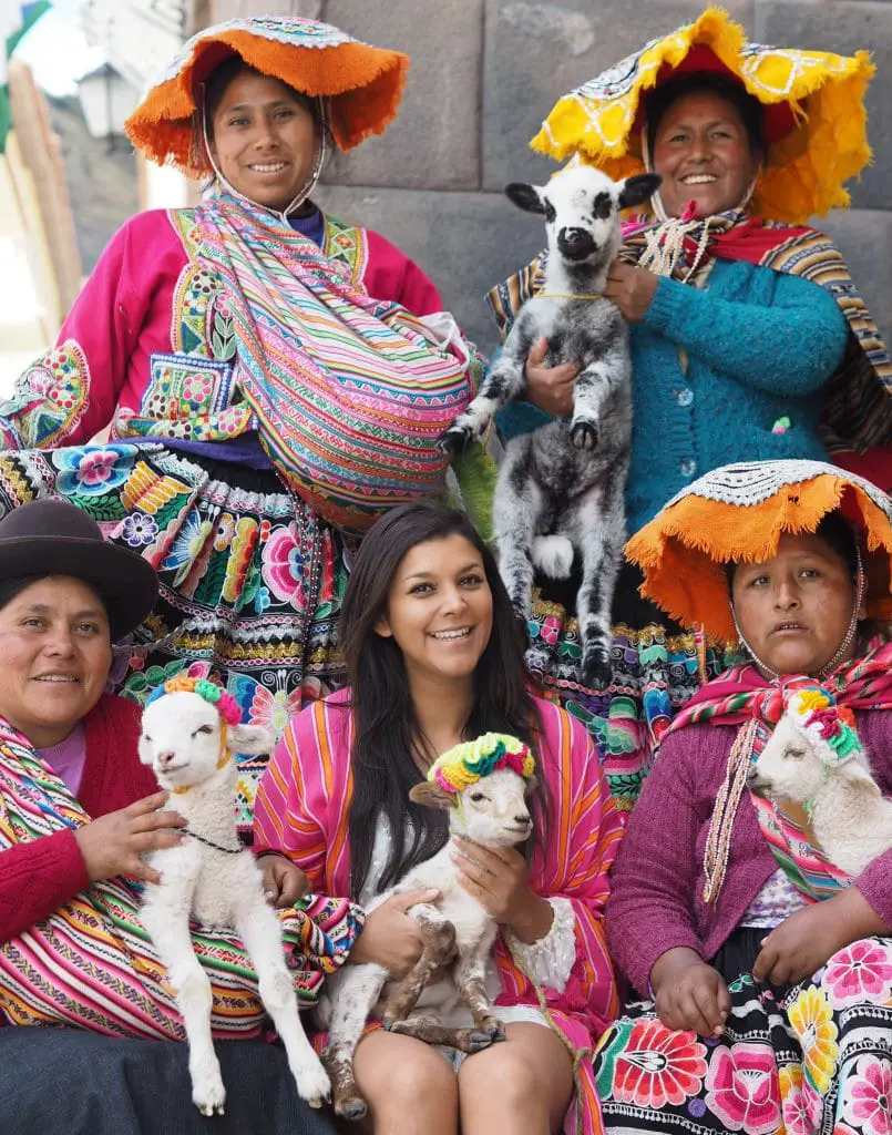 Belmond Monasterio best luxury hotels in Cusco Bonnie Rakhit Ladies in traditional Peruvian costume with lambs