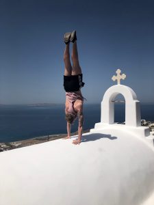 Charlie Van den berg perfects his handstand at Helios retreats