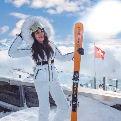Verbier what to wear ski outfits The Alps Bonnie Rakhit wearing Julien MacDonald Dare2Be ski suit Veuve Cliquot skis