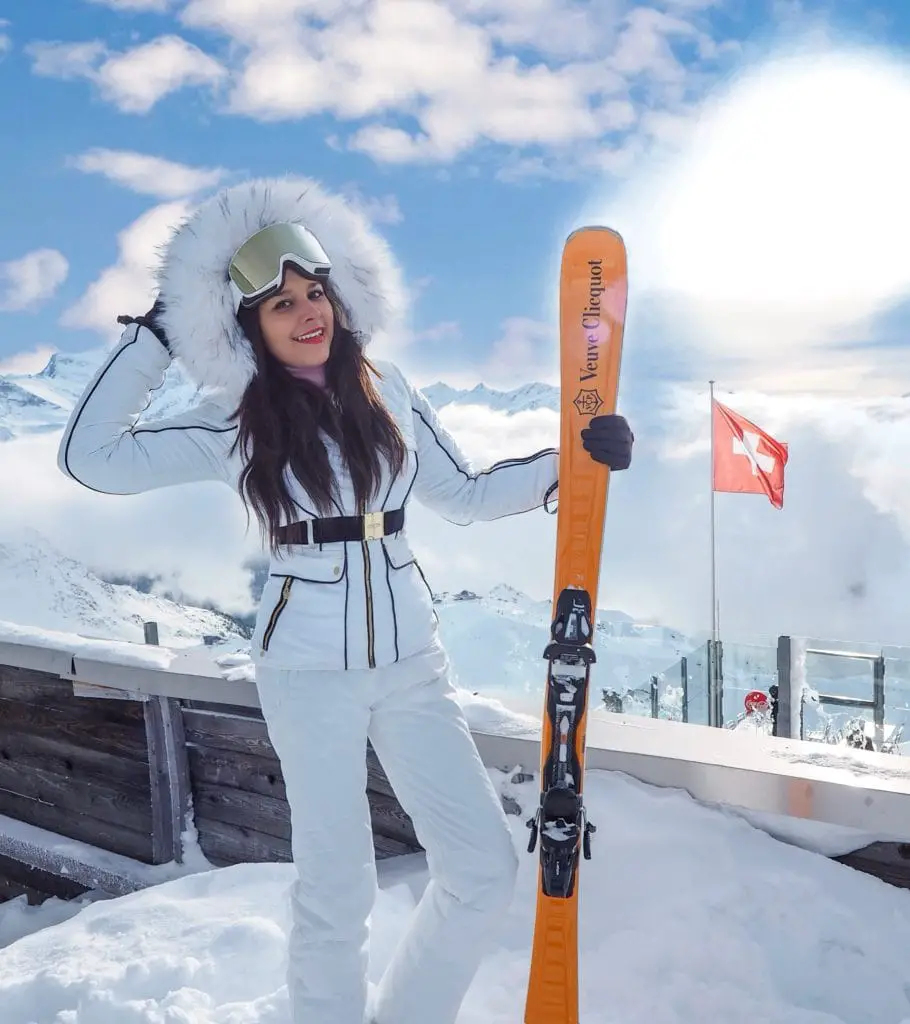 Verbier what to wear ski outfits The Alps Bonnie Rakhit wearing Julien MacDonald Dare2Be ski suit Veuve Cliquot skis