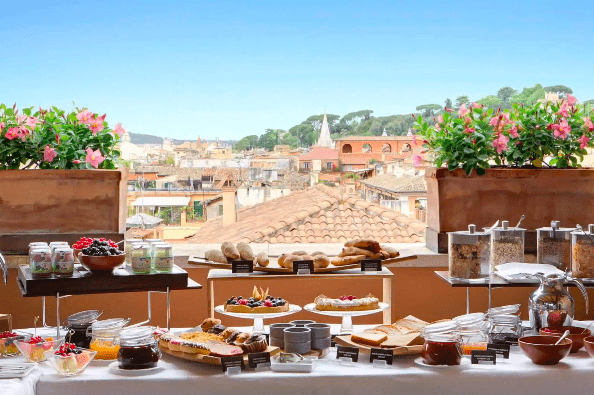 Enjoy a splendid al fresco breakfast on the roof top terrace at Portrait Roma