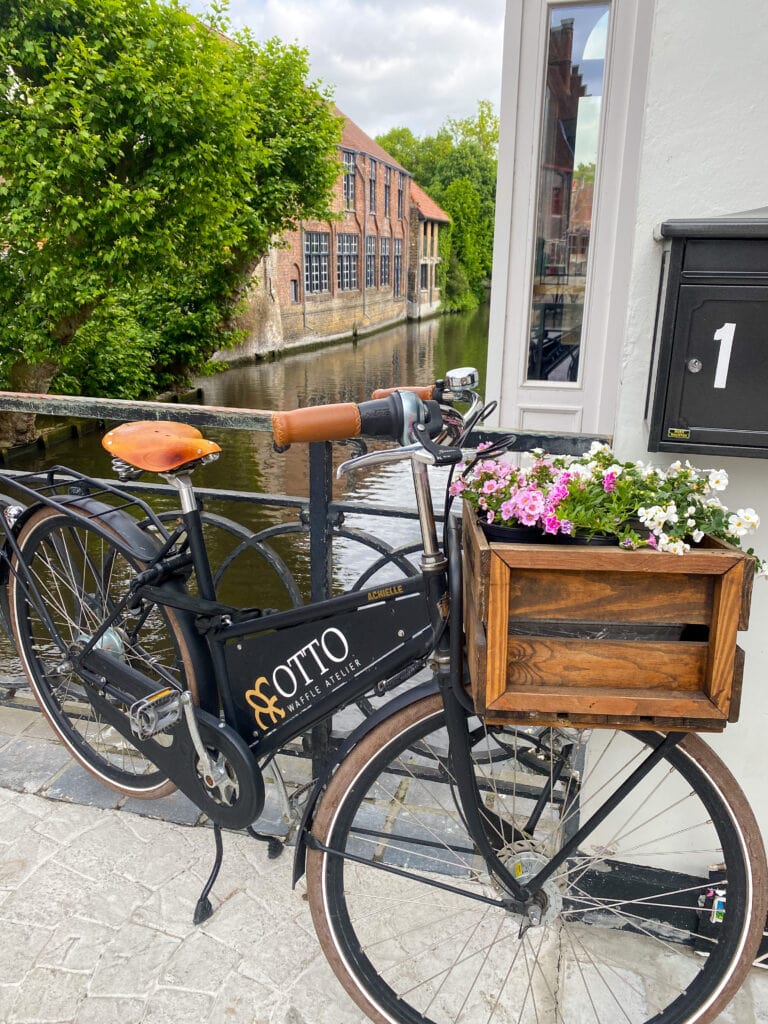 Enchanted princess day 1 Bruges stop bicycle on the lovers bridge