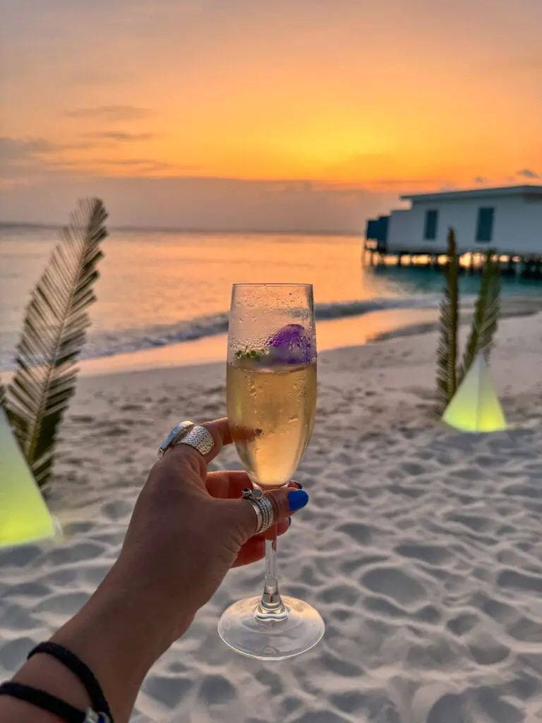 Beach party champagne sunset Amilla Maldives best luxury resorts Indian ocean